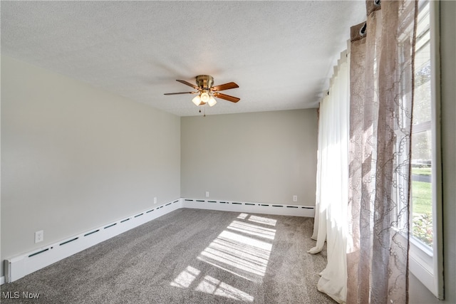 unfurnished room with ceiling fan, baseboard heating, carpet, and a textured ceiling