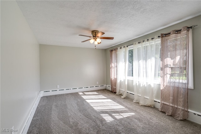 carpeted empty room with ceiling fan, plenty of natural light, a baseboard radiator, and a textured ceiling