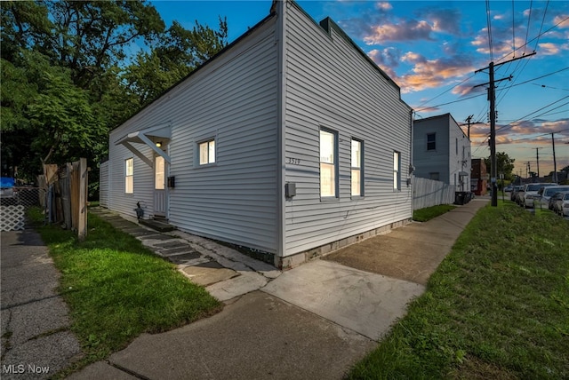 view of property exterior at dusk