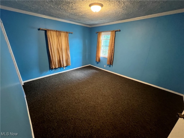 carpeted spare room featuring a textured ceiling and ornamental molding