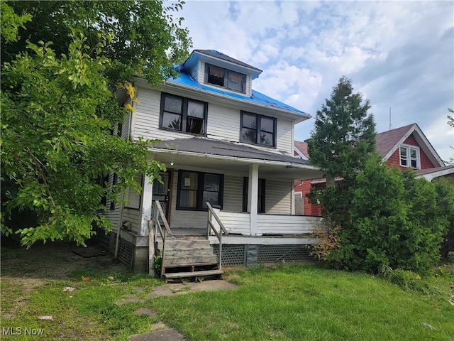 view of front of house featuring a front lawn and a porch