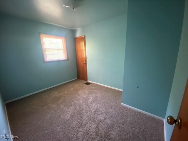 view of carpeted spare room