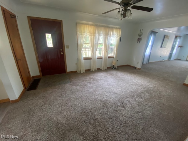 entryway with light carpet and ceiling fan