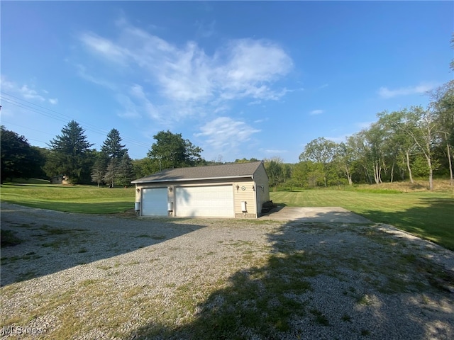 garage featuring a yard