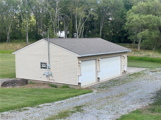 garage with a yard