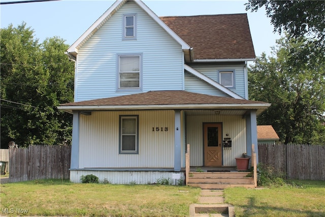 view of front facade with a porch and a front lawn