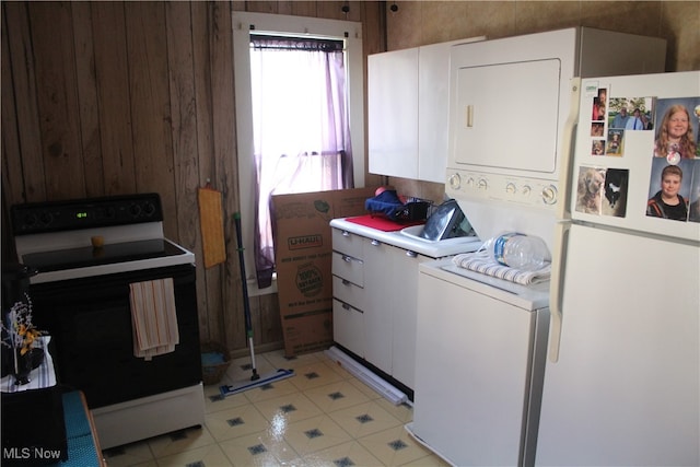 kitchen featuring white cabinetry, white appliances, and light tile patterned floors