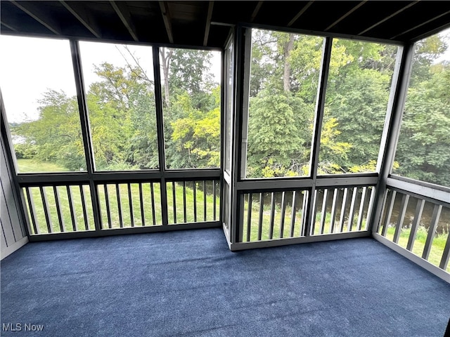 unfurnished sunroom featuring plenty of natural light