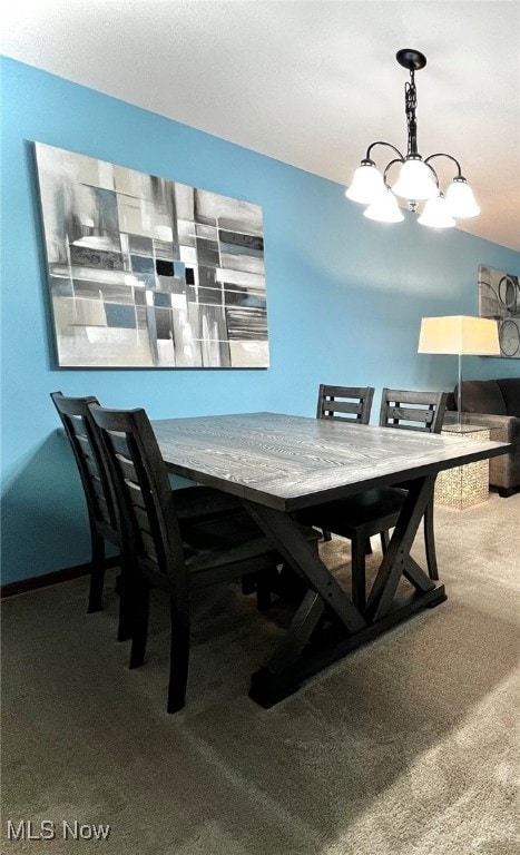 view of carpeted dining space