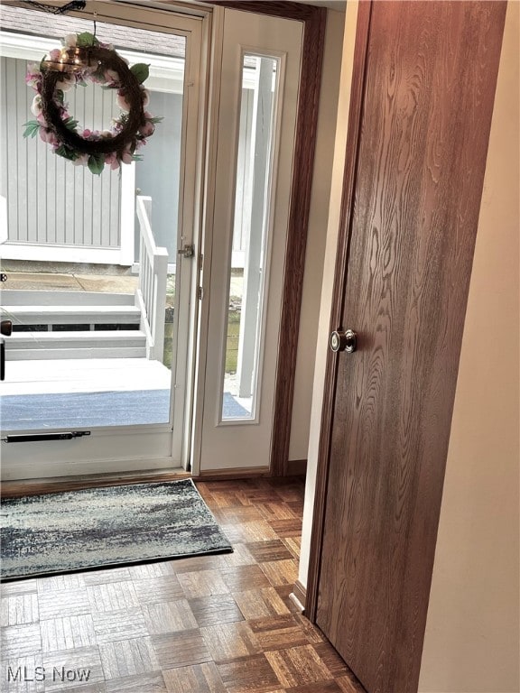 doorway featuring dark parquet floors