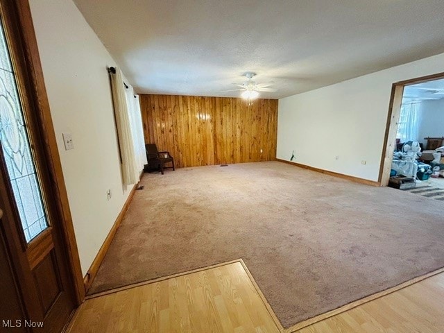 empty room with ceiling fan and hardwood / wood-style floors