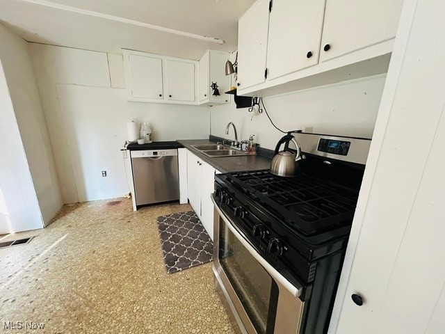kitchen with white cabinets, sink, and stainless steel appliances