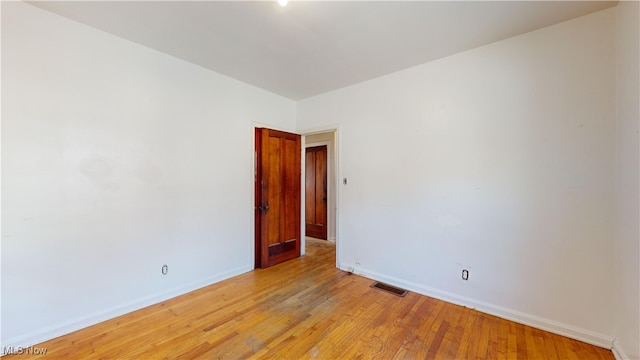 spare room featuring light wood-type flooring