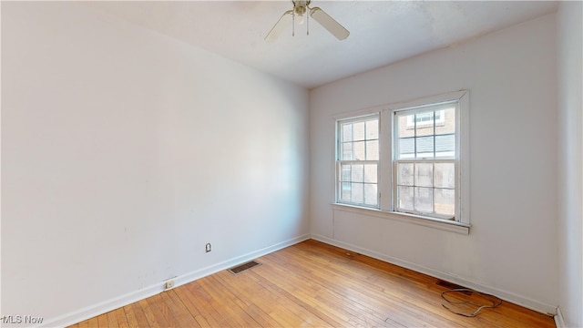 unfurnished room with ceiling fan and light hardwood / wood-style floors