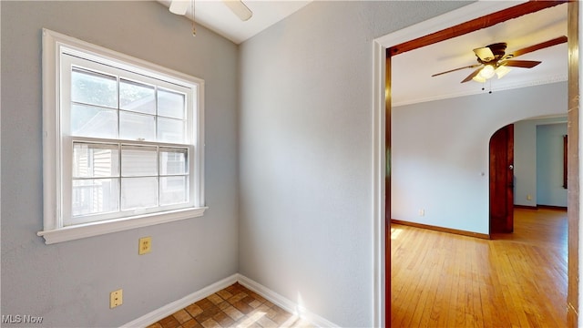 unfurnished room with ceiling fan and light wood-type flooring