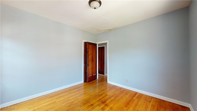 empty room with light hardwood / wood-style floors