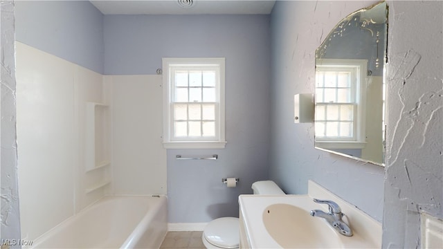 full bathroom with sink, toilet, washtub / shower combination, and tile patterned flooring