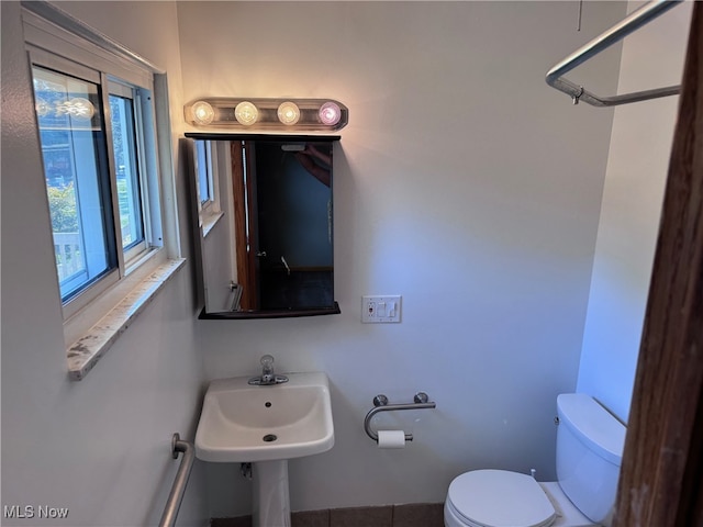 bathroom with sink and toilet