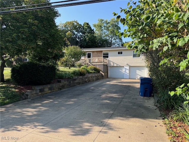 view of front of home featuring driveway and a garage