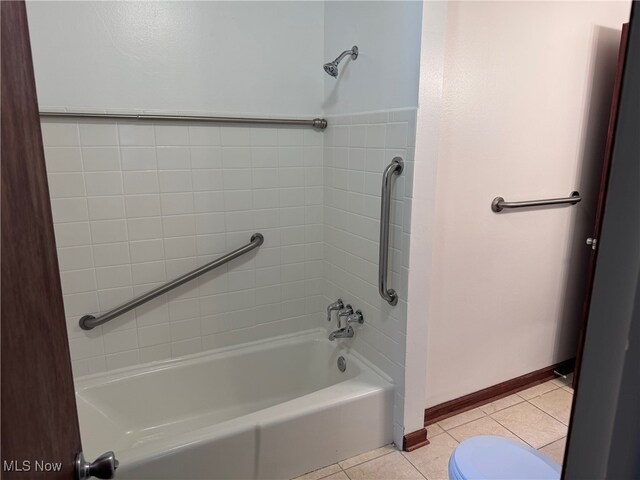 bathroom with tile patterned floors and toilet