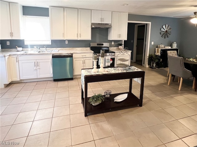 kitchen featuring white cabinets, sink, light tile patterned floors, ceiling fan, and appliances with stainless steel finishes