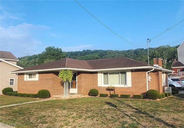 ranch-style house with a front lawn