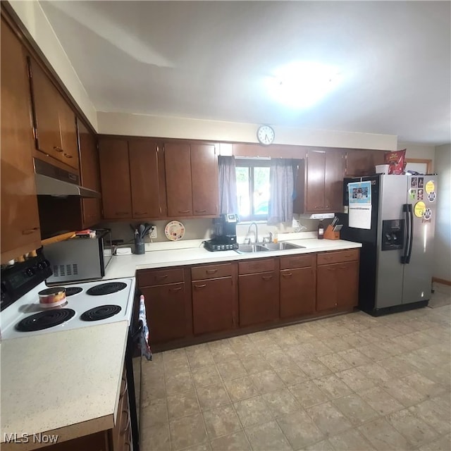 kitchen with dark brown cabinets, light tile patterned floors, stainless steel fridge with ice dispenser, electric range, and sink