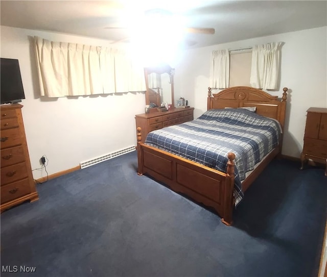 carpeted bedroom with a baseboard radiator and ceiling fan