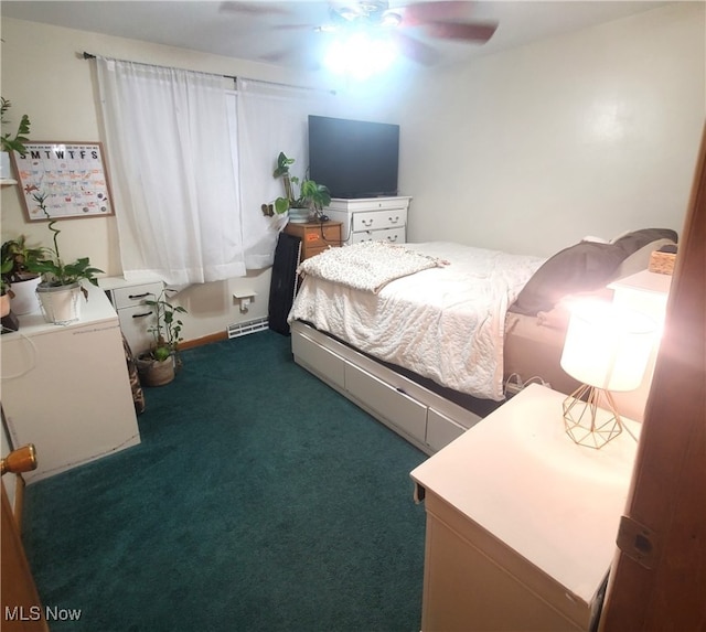 bedroom with dark colored carpet and ceiling fan