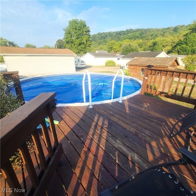 view of pool featuring a wooden deck