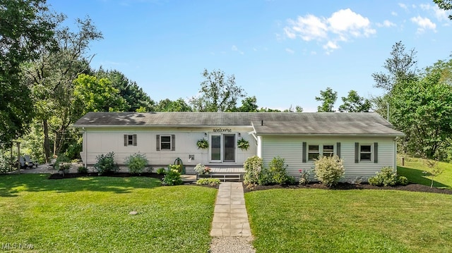 ranch-style house with a front lawn