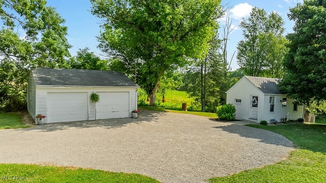 garage featuring a lawn