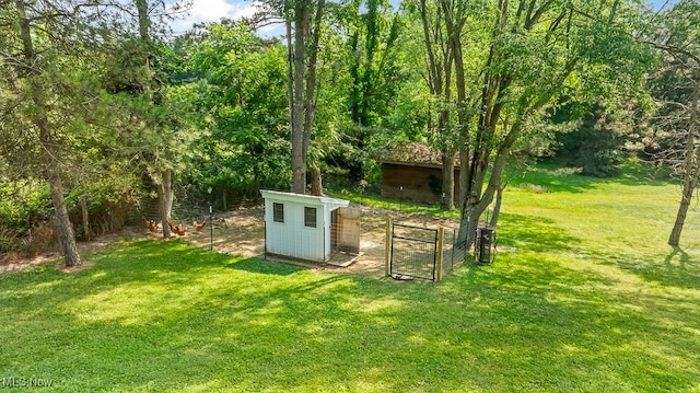 view of outdoor structure featuring a lawn