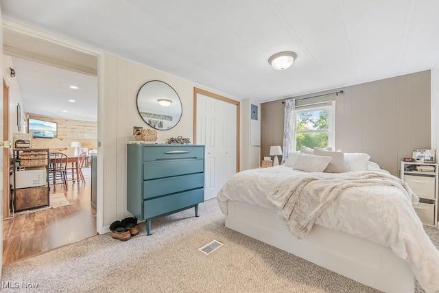 bedroom featuring light carpet