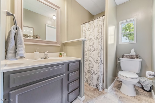 bathroom featuring tile patterned floors, toilet, and vanity