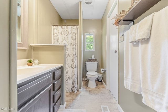 bathroom with tile patterned floors, toilet, and vanity