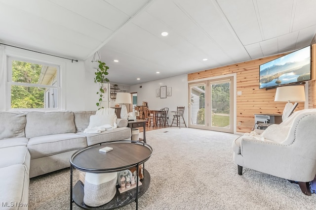 living room with plenty of natural light and carpet flooring