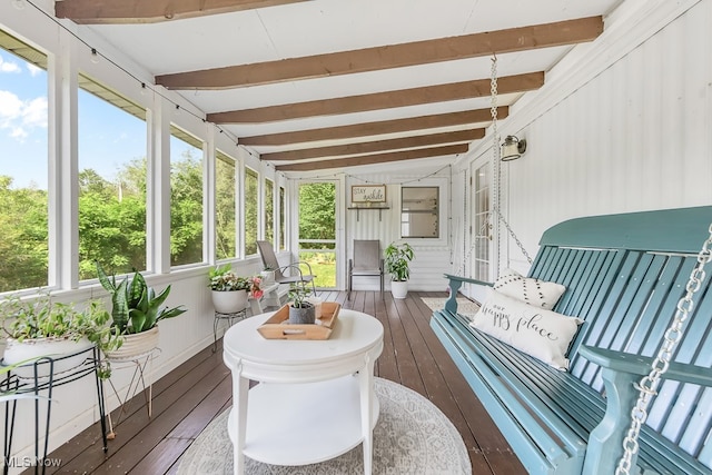 sunroom with lofted ceiling with beams