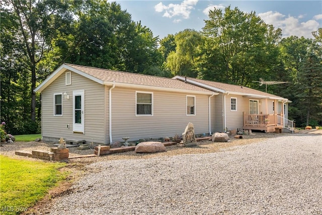 single story home featuring a deck