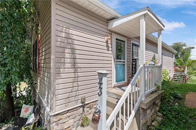 view of side of property with a porch