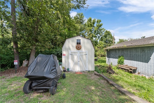 view of outdoor structure featuring a lawn