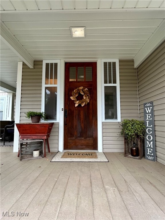 doorway to property featuring a porch