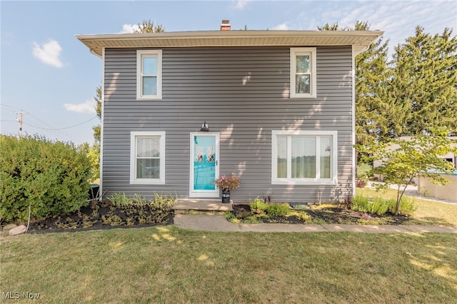 view of front of home with a front yard