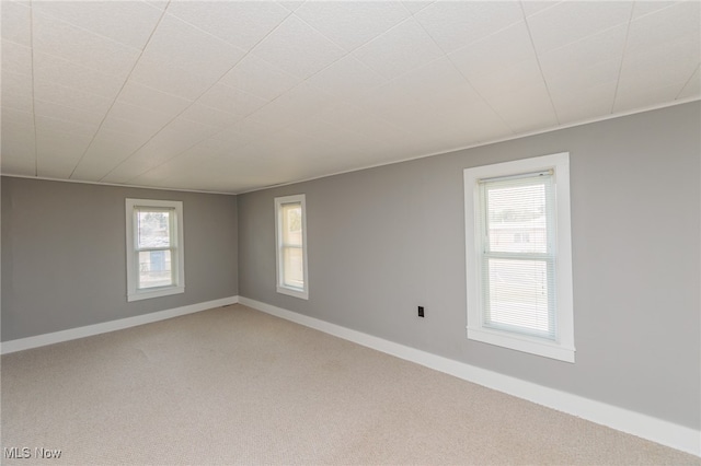 unfurnished room featuring carpet flooring