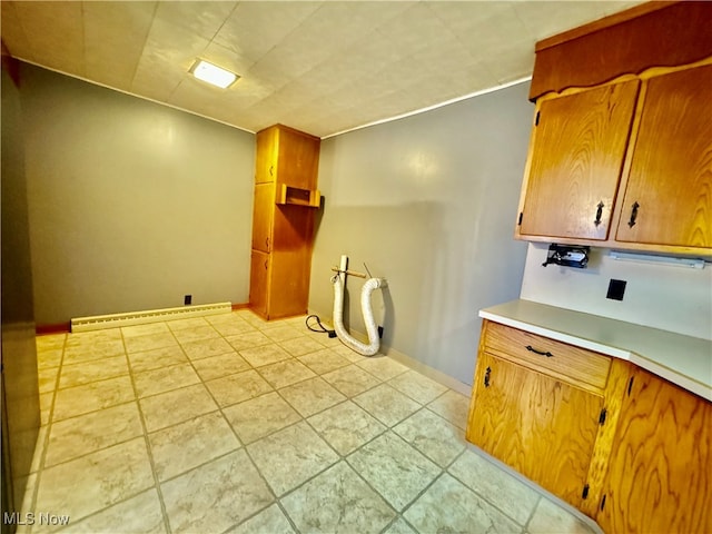 kitchen featuring light tile patterned floors and a baseboard radiator