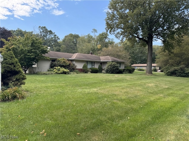 exterior space with a front lawn