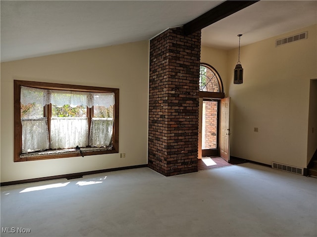 unfurnished living room featuring carpet, brick wall, and vaulted ceiling with beams