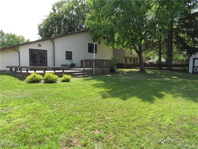 exterior space with a wooden deck and a shed