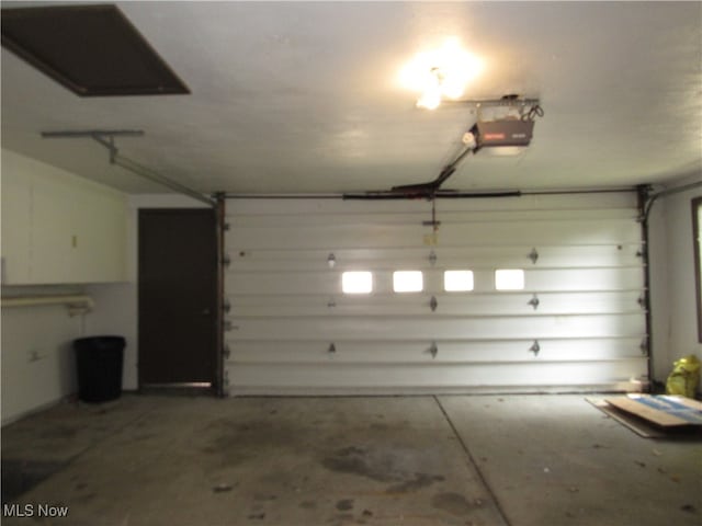 garage featuring a garage door opener