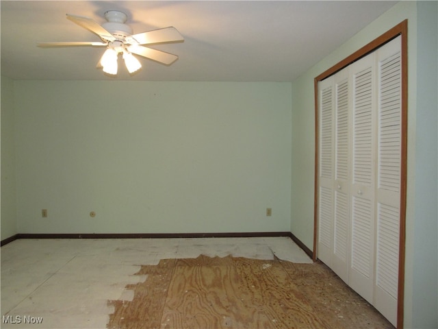 unfurnished bedroom featuring ceiling fan